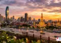 Bangkok skyline at sunset with modern towers and temples - expatriate lifestyle Thailand