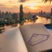 Thailand visa exemption 2026: Bangkok skyline at dusk with Thai flag — covered by Vivre en Thaïlande