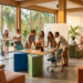 Groupe de professionnels collaborant dans un espace de coworking lumineux avec vue sur la mer à Koh Phangan.